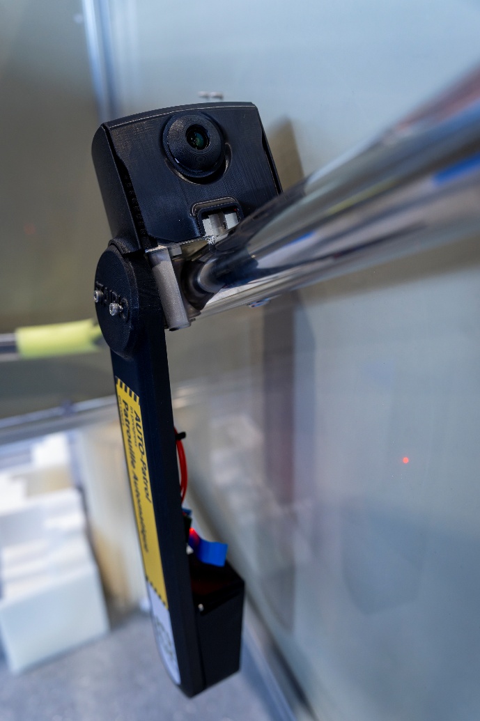 Close-up of Stairio’s patented handrail-affixed sensor and locomotion module